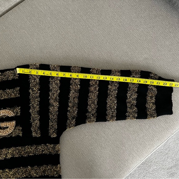 DOLCE&GABBANA
Cashmere blends
Black and gold sweater - Picture 12 of 13